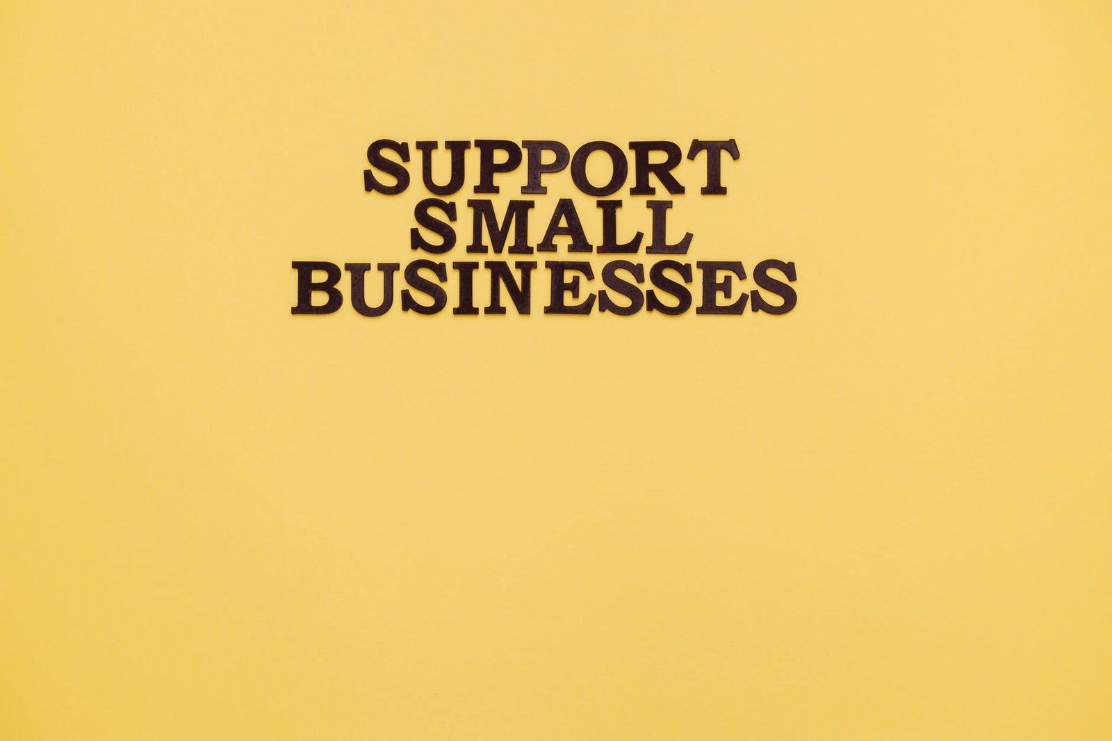 website platform planning session with printed page layouts and business notes